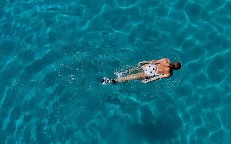 a woman swimming in water